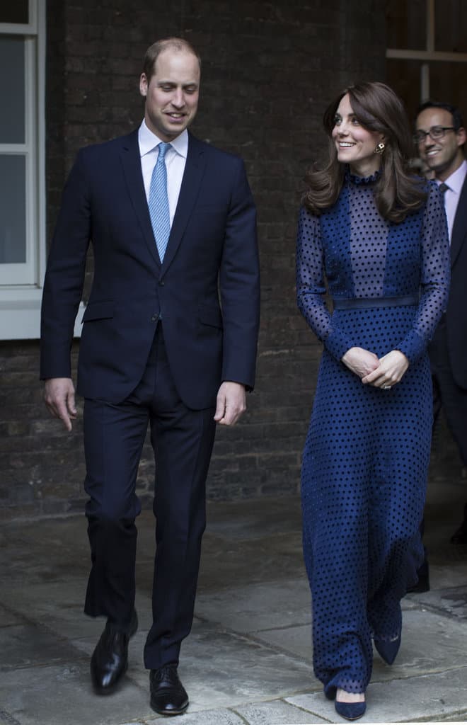 Demure Duchess of Cambridge keeps her legs under wraps